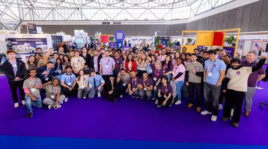 Group photo of the FacilityApps team at a trade fair